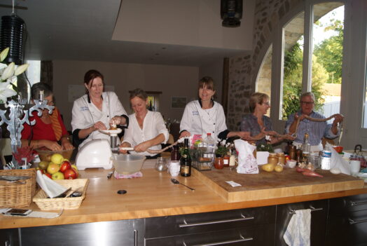 guests being chefs at our French cooking class