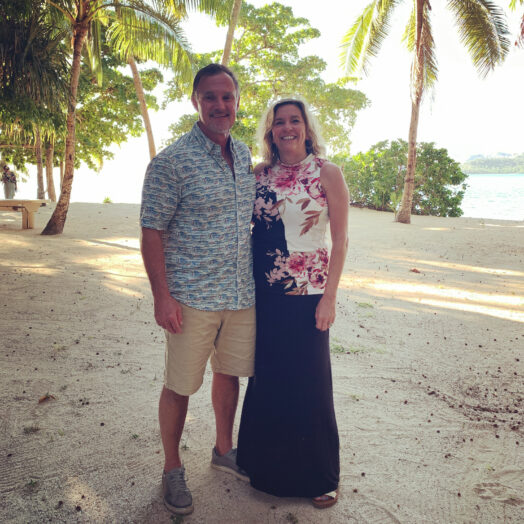 A couple standing on the beach in Turtle Island, Fiji