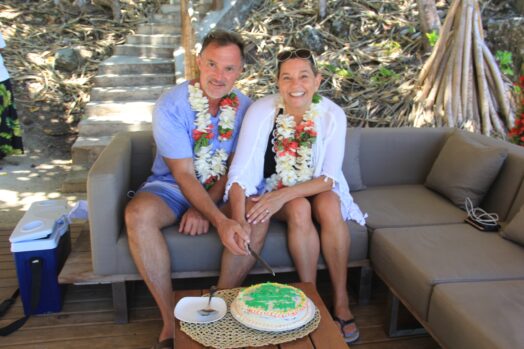 A couple celebrating an anniversary at Honeymoon beach on Turtle Island