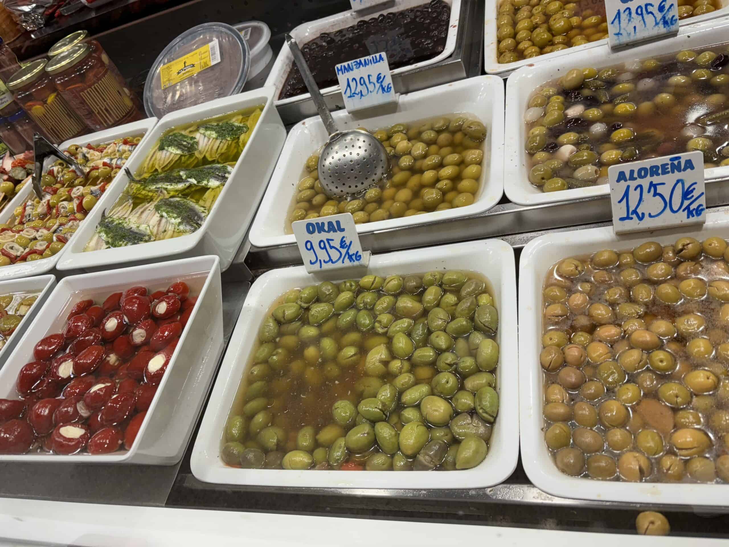 barrels of olives for sale in a market