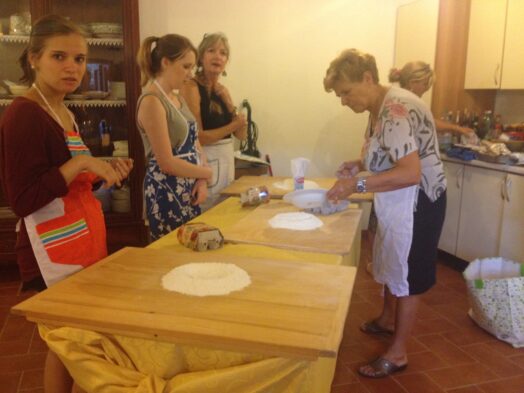 People taking a cooking class in Tuscany