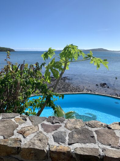 a beautiful blue pool overlooking the ocean in Fiji