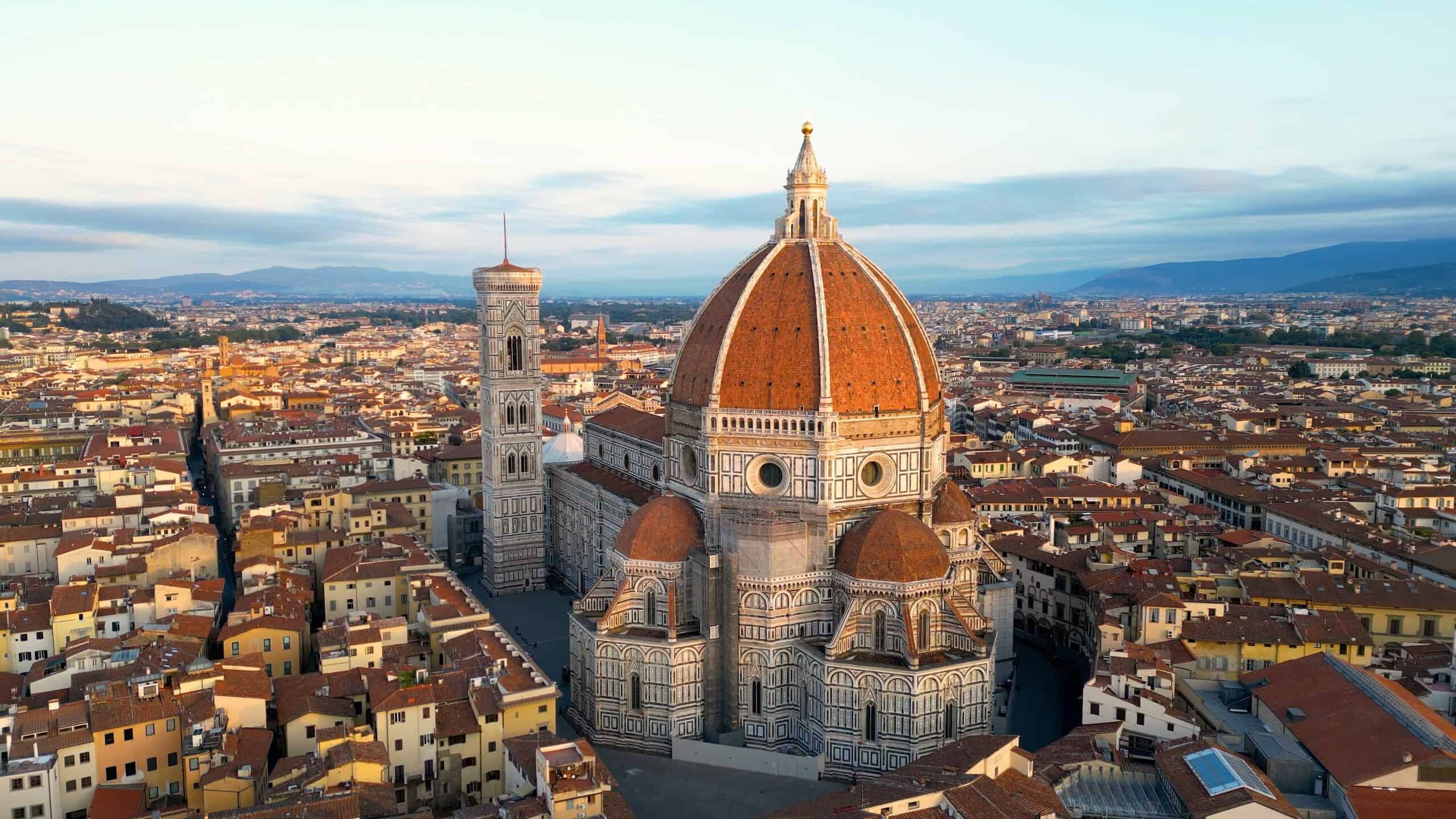 Florence Cathedral Dome with cityscape view, Italy, during sunset.