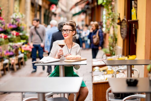 A woman eating at a restaurant in Bologna Italy