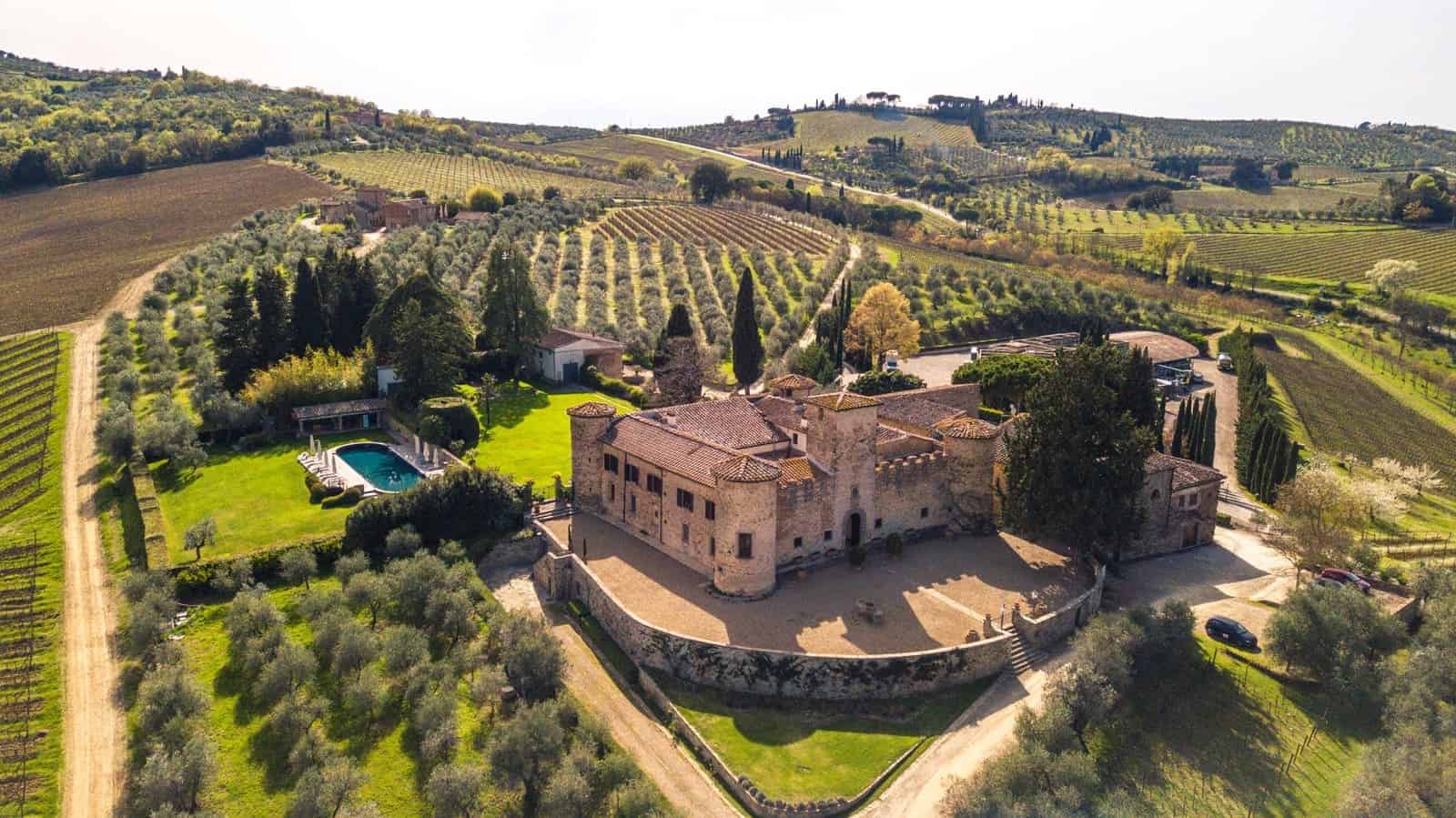 Elegant Tuscan villa with vineyards and scenic countryside views.