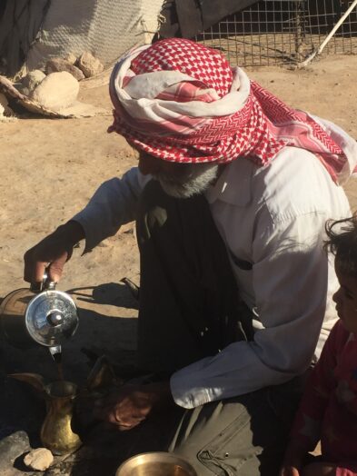 a bedouin in jordan making coffee