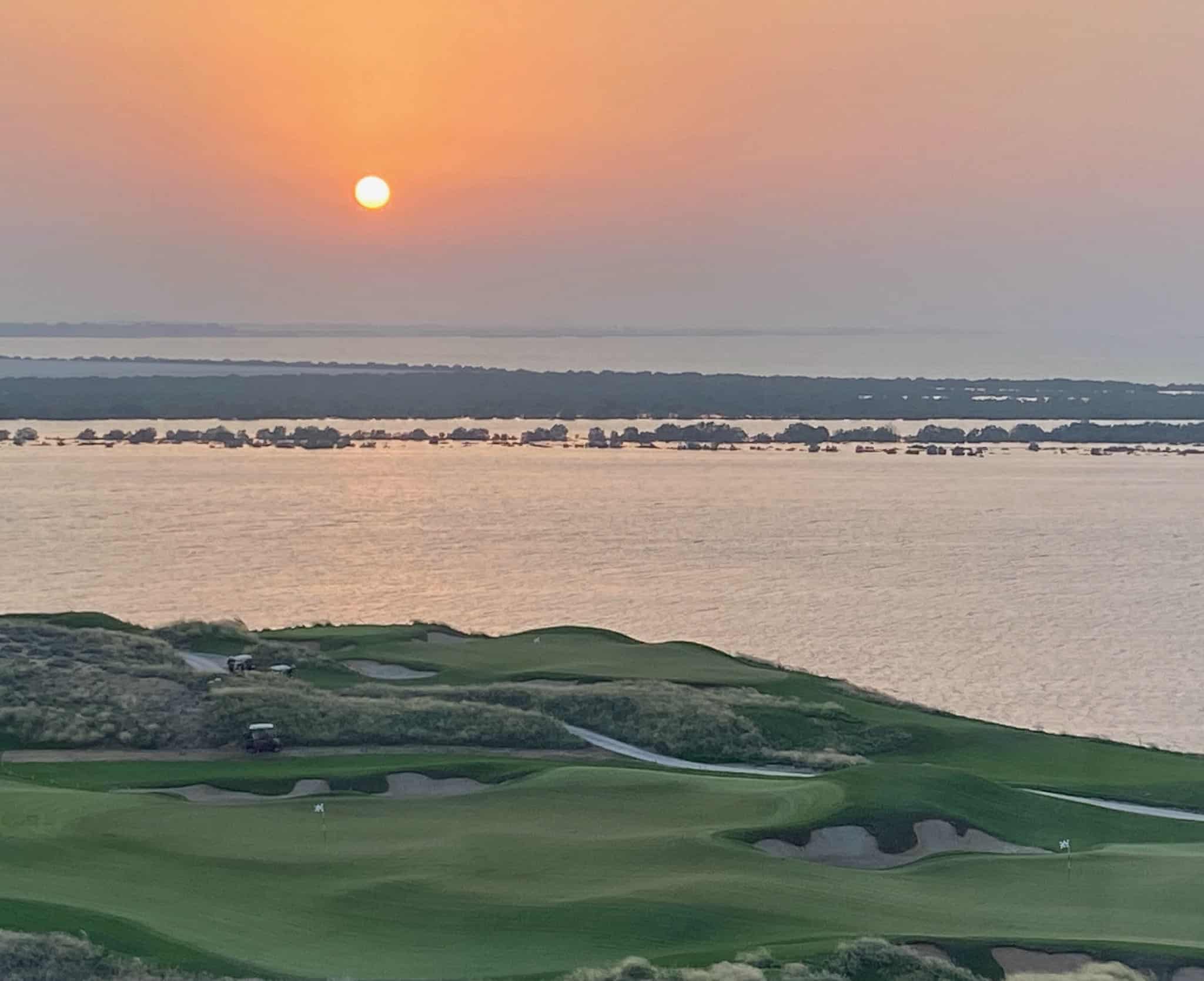 a sunset view of a golf course in Abu Dhabi