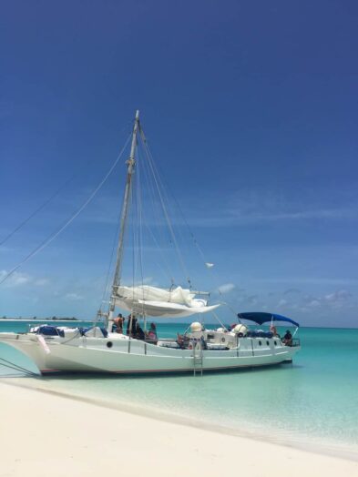 a sailboat on the beach in the turks & caicos