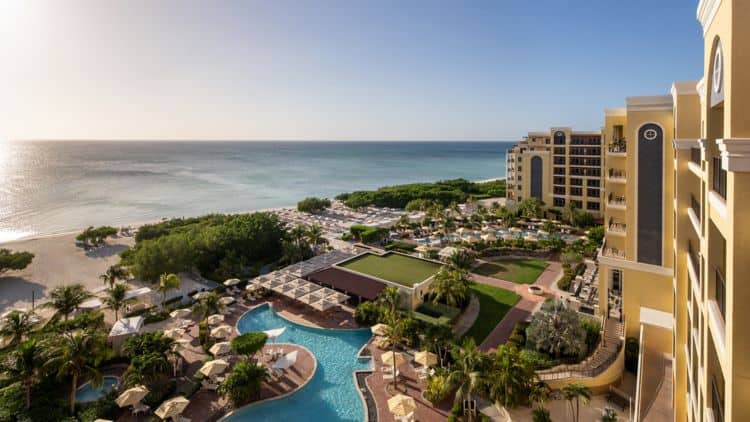 Beachside resort with ocean view, pool, and tropical gardens in a luxurious coastal setting.