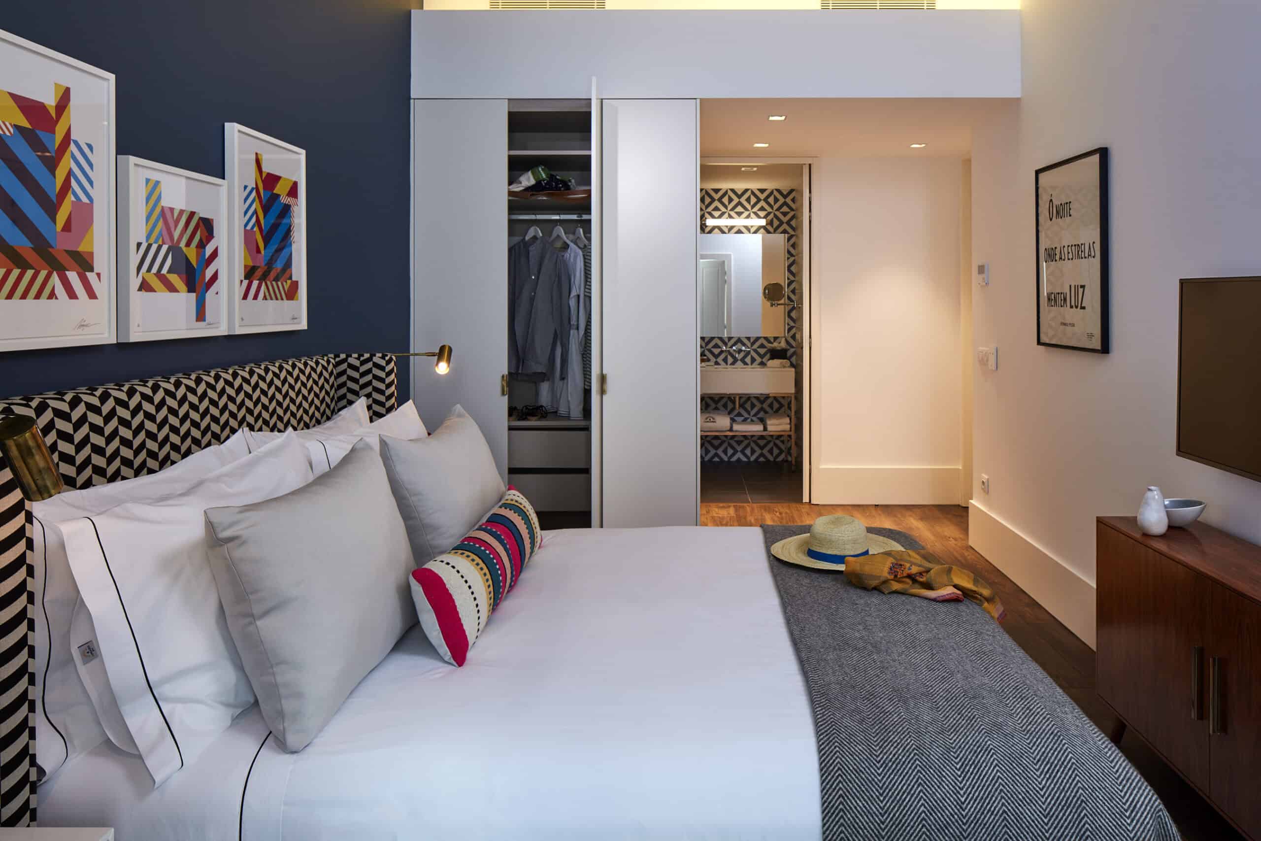Comfortable bedroom featuring contemporary design and vibrant artwork, perfect for relaxing after ex.