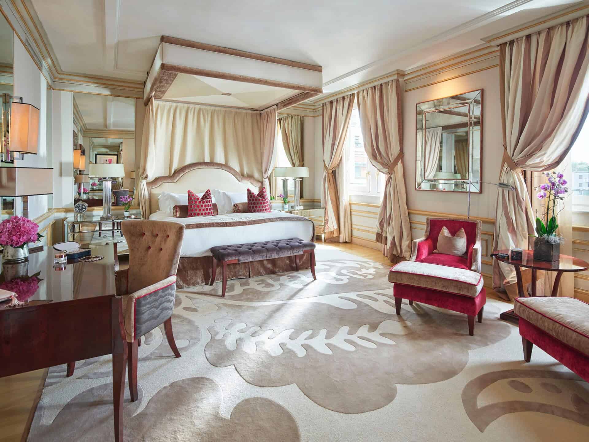 Elegant hotel suite with luxurious decor and plush seating in Milan, Italy.