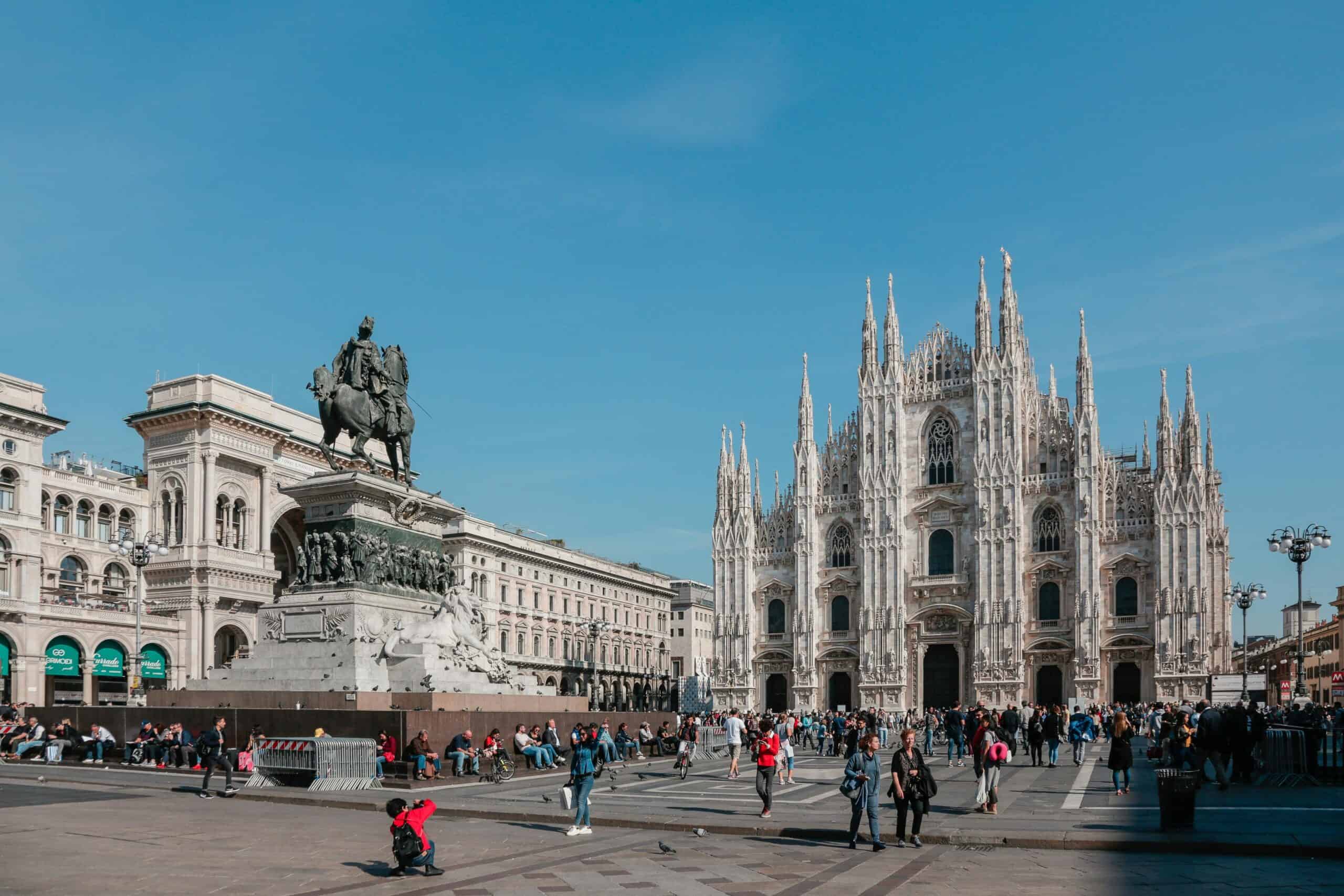 Milan Cathedral, a stunning Gothic masterpiece in Italy's fashion capital, bustling with tourists an.