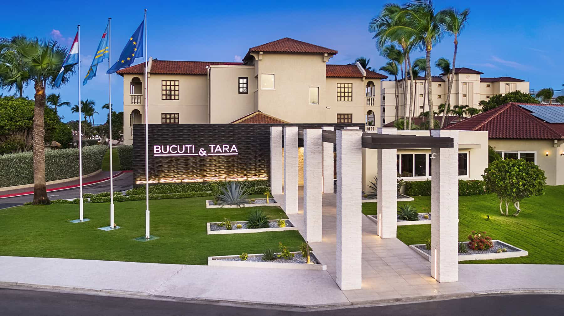 Bucuti & Tara Beach Resort Aruba with lush gardens and palm trees.