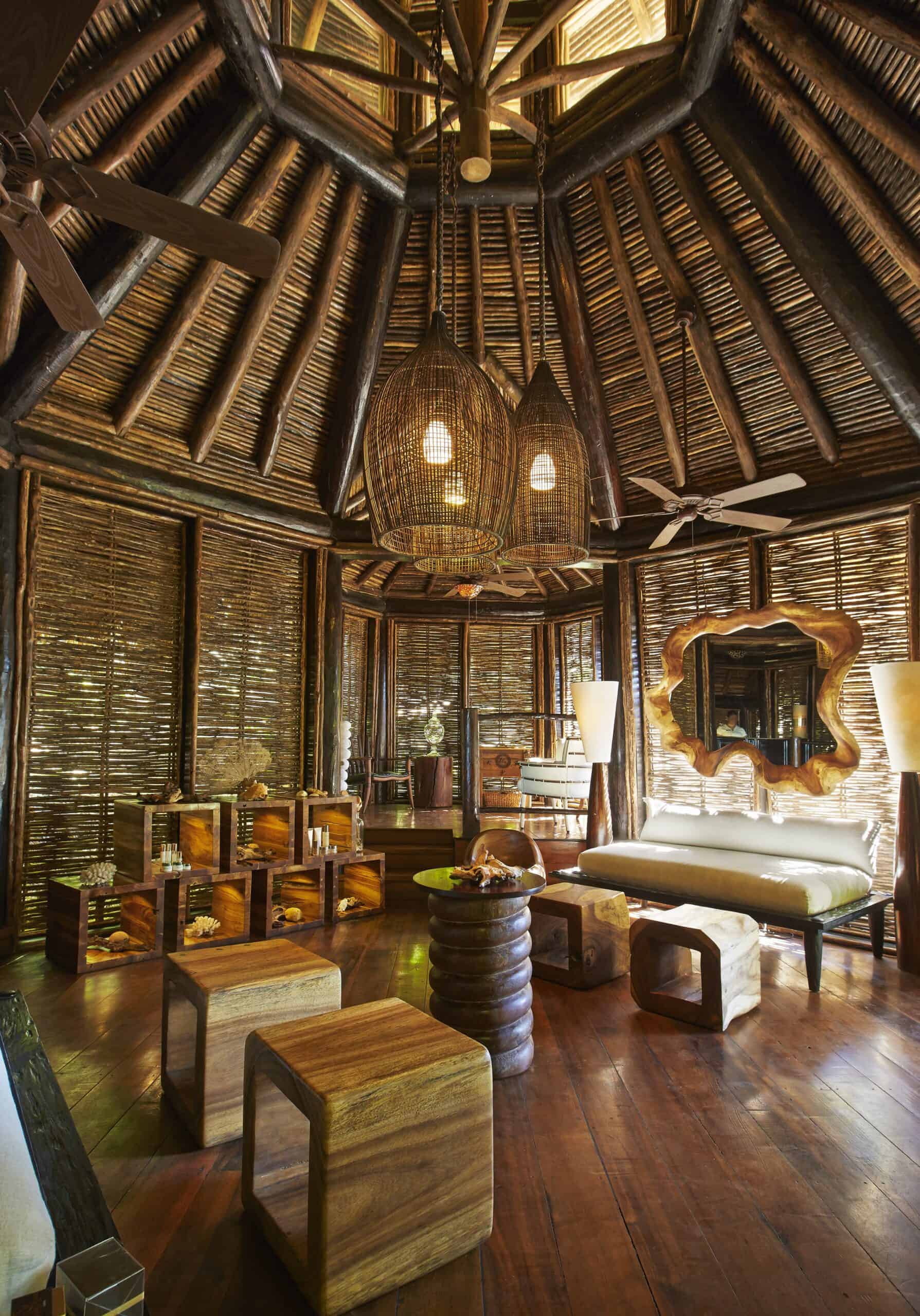 Cozy tropical living room featuring rattan furniture, wooden accents, and natural lighting in a that.