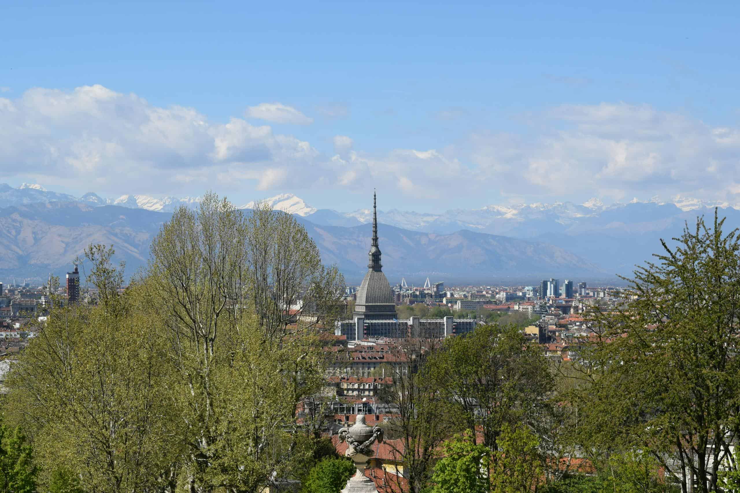 Jet d'Eau fountain with Mont Blanc in the background, showcasing Geneva's skyline and scenic mountai.