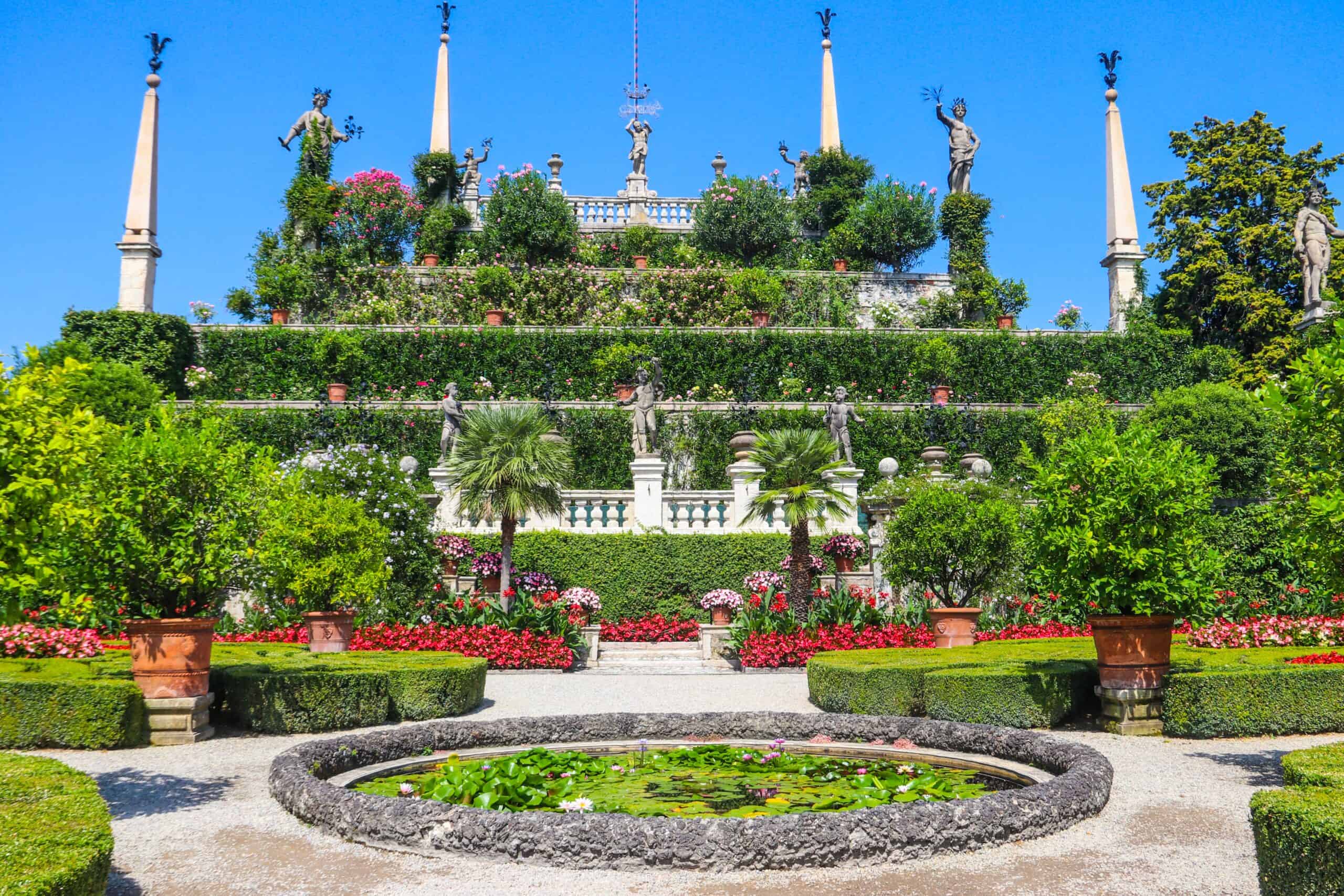 Beautiful Italian garden with statues and lush greenery on Lake Maggiore.