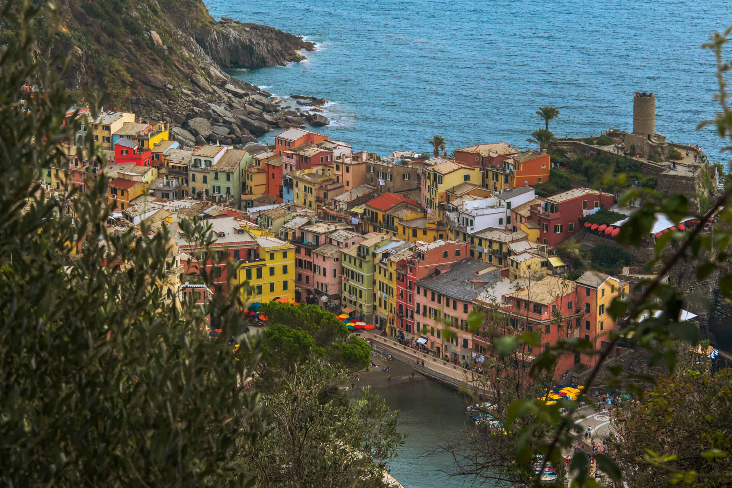 Vibrant Italian seaside village with colorful buildings and ocean view.