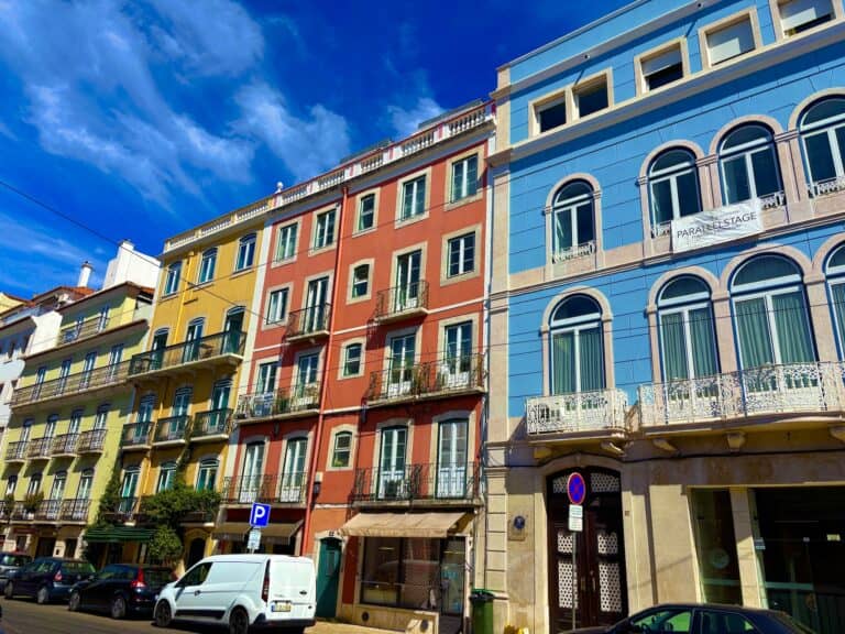 Vibrant multi-colored buildings along a street in Porto, Portugal.
